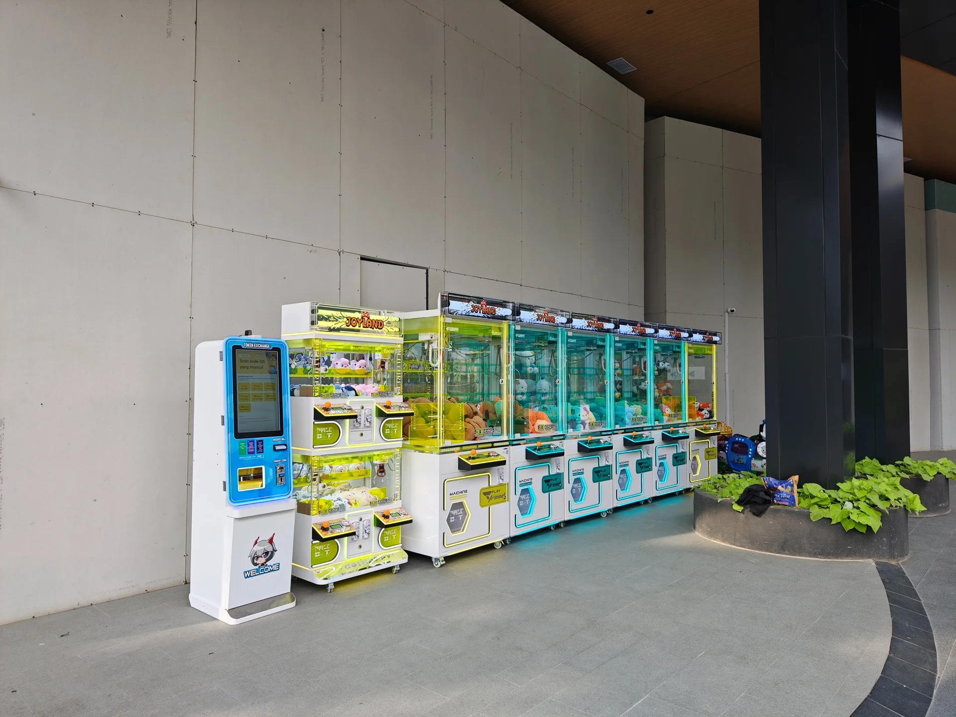 A compact row of Joyland machines arranged neatly along a covered walkway