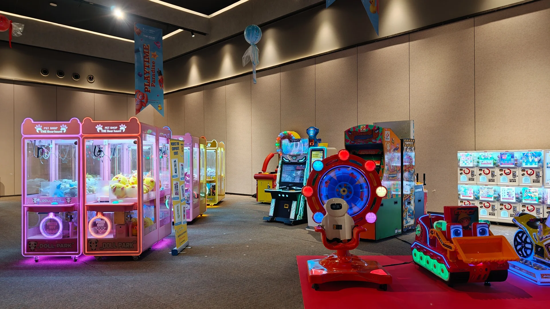 A complete Joyland arcade installation glowing inside a modern entertainment venue